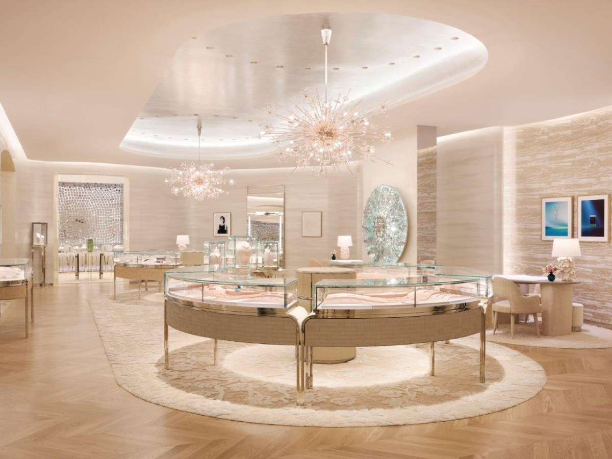 Interior light cove mouldings around a curved opening in retail store