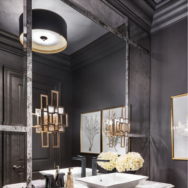 Guest bathroom interior from "Moving the McGillivrays" featuring custom dark-grey plaster-coated crown moulding by Mouldex Composites, paired with a modern vanity and geometric lighting.