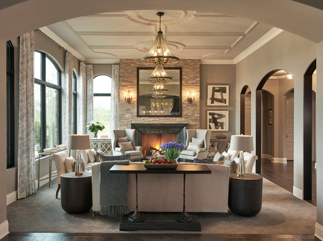 Luxurious living room featuring an intricate coffered ceiling with circular medallions and decorative plaster-coated foam mouldings in a Restoration Hardware aesthetic.