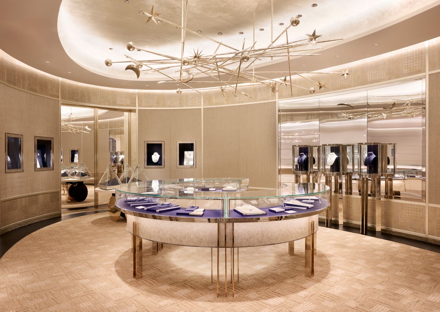 A wide-angle view of a circular luxury jewelry showroom at Tiffany & Co. Yorkdale, featuring custom-curved architectural ceiling mouldings, integrated cove lighting, and high-end display cases by Mouldex Composites.