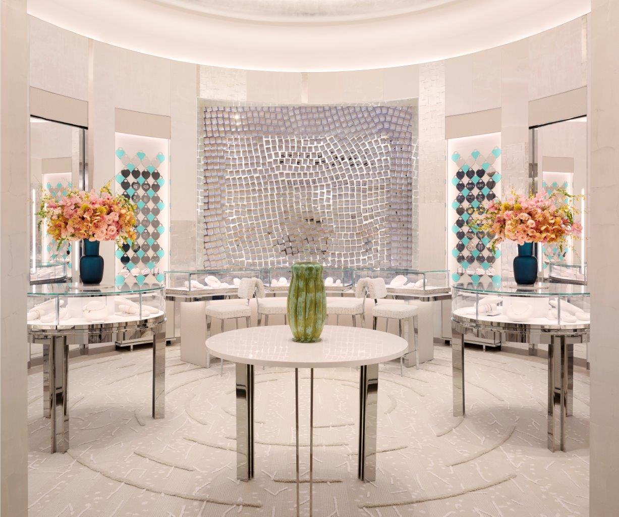 Symmetrical view of the Tiffany & Co. luxury jewelry showroom at Yorkdale Mall, featuring circular architectural ceiling mouldings and modern glass display cases by Mouldex Composites.